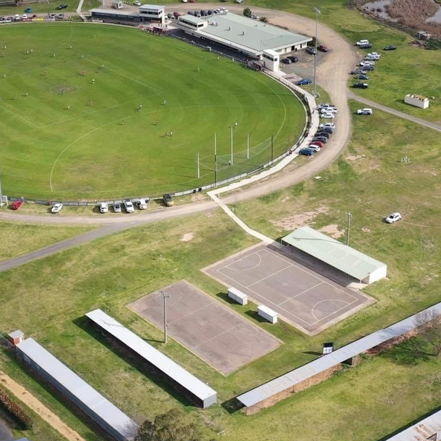 Chris-obrien-civil-netball-before Aerial photo of a football ground and old netball courts